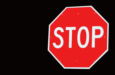 Stop Sign Isolated on Black with Copy Space