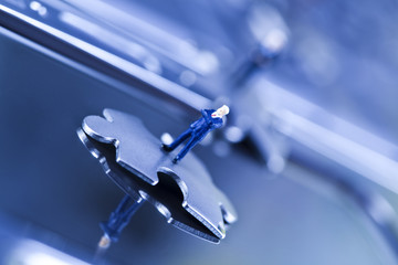 Laptop with figure over chrome background