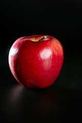red apple over black background