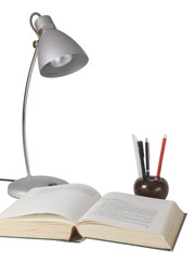 Silver lamp and open book