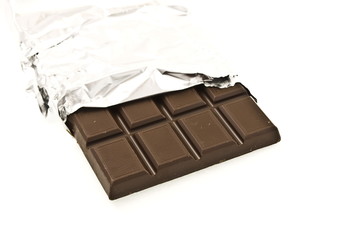 Chocolate on a foil on a white background is isolated