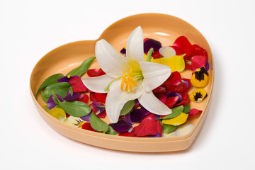 Fototapeta na wymiar Heart gift with flower petals