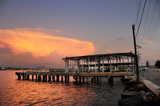 Abandoned pier at sunset