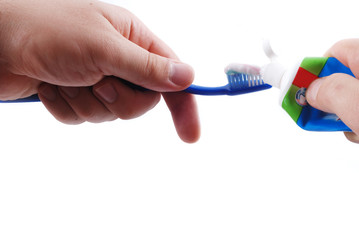 Dentifrice and brush in hands