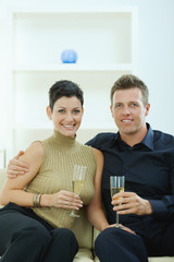 Couple clinking with champagne