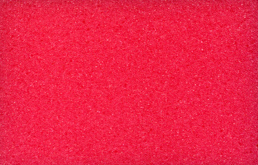 red background, texture of foam rubber