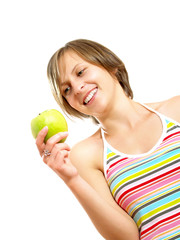 Smiling cute girl holding a green apple