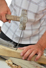 Hammer pounding nail