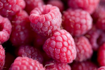 Ripe red raspberries as background