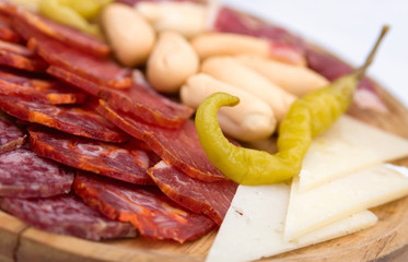 Appetizer platter of cold meats and green chili