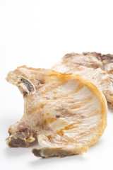 tasty pork chop with corn carrot tomato