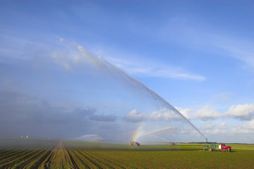 Tractors watering plants