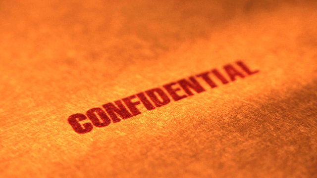 Confidential stamp on a manilla folder