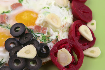 fried eggs and red eggplant