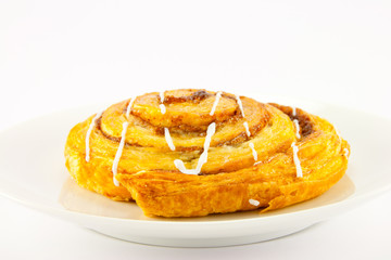 Cinnamon Bun on a White Plate