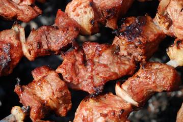 Preparation of meat on fire