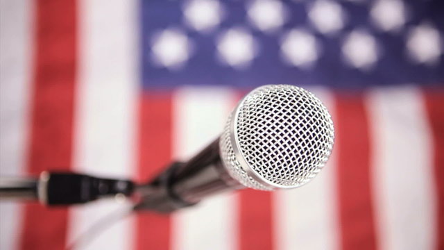 Vertical, American flag and microphone, dolly shot