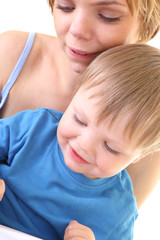 Mother help her son with drawing.