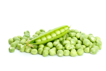 Cracked pod over pile of green peas