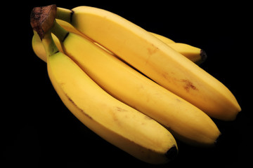 Bunch of Yellow Bananas on Black Background