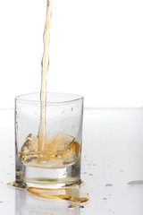 Shot of Bourbon Poured into Short Glass