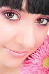 Young woman with gerber flower