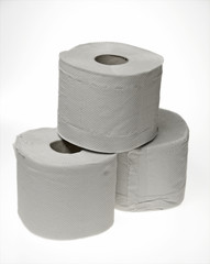 three toilet rolls on white background