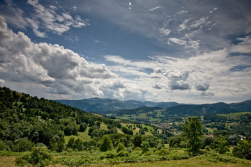 Naklejka na ściany i meble Cloudy valley in Alsace