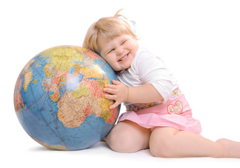 baby girl holds a globe
