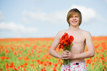 Smiling man with poppies