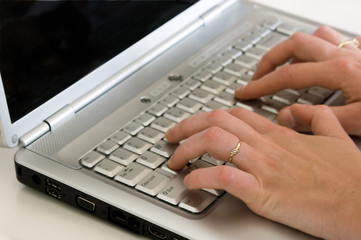 Closeup of a hands typing on the keyboard