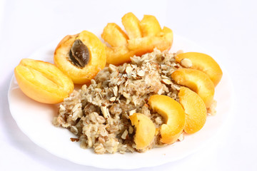 apricot, porridge and almonds on a plate