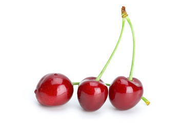 Three red cherries