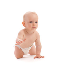 Portrait of adorable baby boy crawling over white