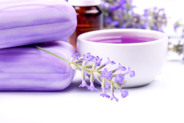 Obraz na płótnie Canvas Lavender plant with soap and herbal extract