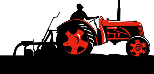 Obraz premium Farmer driving his tractor