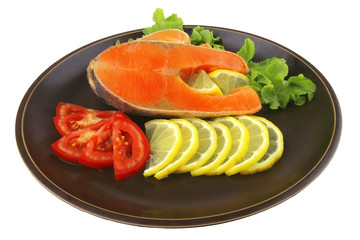 two salmon steak on dark dish