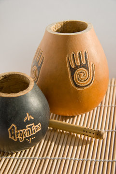 Vessel for drinking mate (gourd) and a straw (bombilla)