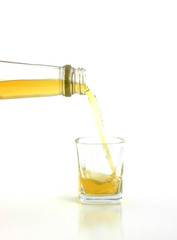 Scotch pouring into glass