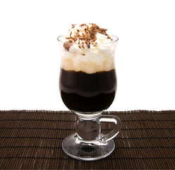 Cup of freshly coffee latte with creams and chocolate chips
