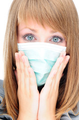 Young woman with medical mask afraid of the virus spread - 15386858
