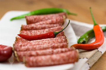 Sliced salami with peppers