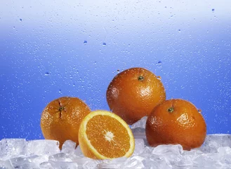 Foto op Plexiglas Sinaasappels op ijs © Juergen
