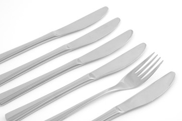 Vier Messer und eine Gabel