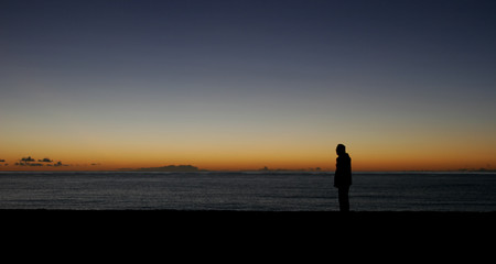 Fototapeta premium man enjoys the sunrise