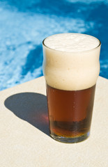 Glass of Beer by the Swimming Pool