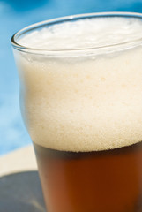 Glass of Beer by the Swimming Pool