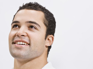 Obraz premium Attractive Man Looking Up and Smiling