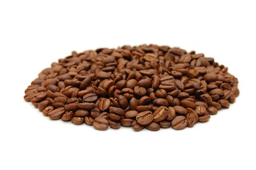 hill of coffee grains over white