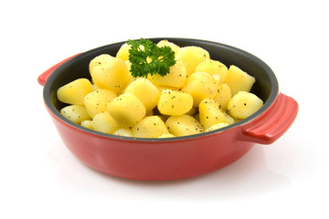 red pan with fresh baked potatoes